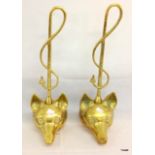 2 brass door stops in the shape of foxes