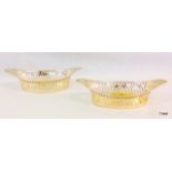 A pair of silver embossed bon bon dishes 17 x 7cm