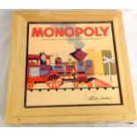 A wooden cased Monopoly board game in unused condition