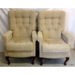 A pair of Parker Knoll style wingback chairs