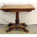 A walnut games table on claw feet 78 x 92 x 45