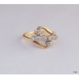 An 18ct gold 7 stone diamond crossover approx 0.45ct hallmarked size M