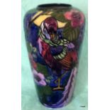 A Trogan ware Moorcroft style vase decorated with a bird and foliage c1930 24cm high