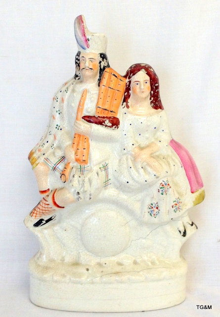 A 19th century Staffordshire figure of Scottish figures 37 x 20 x 8cm