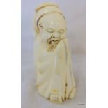 C19th ivory figure of a robed sleeping man