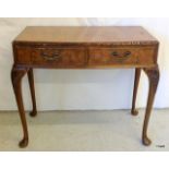 A 2 drawer walnut hall table on cabriole legs