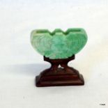 A Jade fan holder carved as a bat the Happiness emblem Chlen Lung 1786-1795