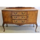 A 2 door 3 drawer walnut sideboard