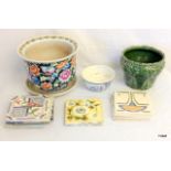 A decorative tiles and plant pots to include Delft ware