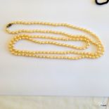 A set of strung cultured pearls 125cm long