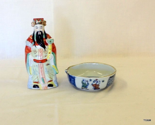 An Oriental rice bowl and Chinese Figure