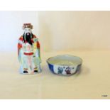 An Oriental rice bowl and Chinese Figure