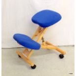 An upholstered office posture chair