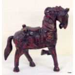 A Chinese wooden carved horse 38 x 34 x 11cm