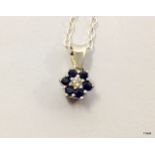 A White gold sapphire and diamond pendant necklace