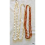 2 pearl necklaces one with a 9ct gold clasp and a coral necklace