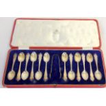 Set of 10 silver spoons & pair tongs