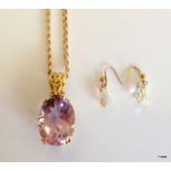 A 9ct gold Amethyst pendant and earrings