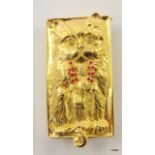 A gold plate of sterling silver vesta case in the form of a cat the eyes set with diamonds and bow