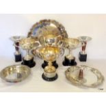 A collection of silver plated items to include trophies and trays