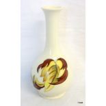 A Moorcroft white glazed vase with flower decoration 20.5cm high