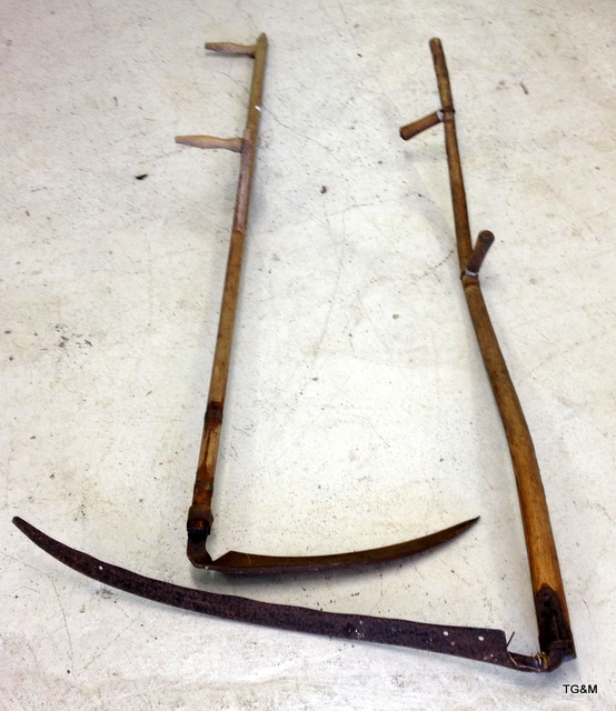 2 wooden handled scythes 172cm long and 160cm long