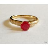 A 9ct gold ruby and diamond shoulder ring size N