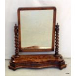 A mahogany dressing table mirror on twist support