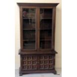 A 2 glazed door with 2 door base oak glazed bookcase