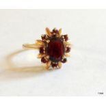 A 9ct gold garnet ring size M