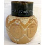 A Doulton Lambeth Victorian jug depicting Queen Victoria with impression mark to the base