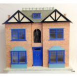 A Childs Edwardian dolls house with quantity of furniture