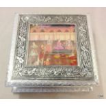 An Indian white metal box with pictorial inserts. 7 x 20 x 20cm