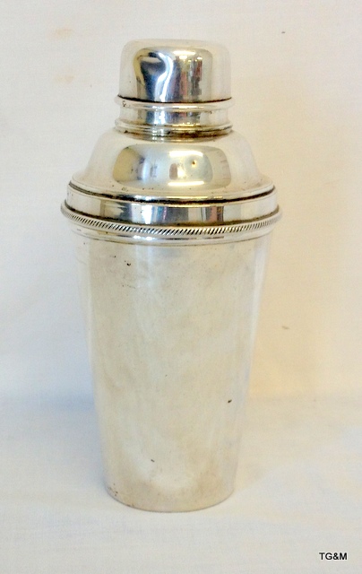 A silver plated cocktail shaker 21cm high