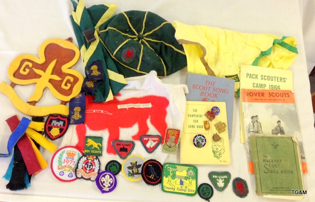 A quantity of vintage Boy Scout and Girl Guides memorabilia including badges - neckerchiefs -