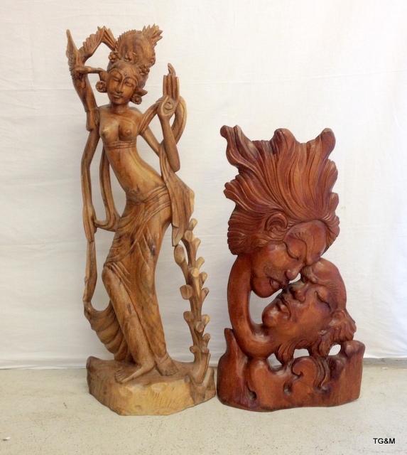 A pair of carved wood oriental statues 1 x 83cm and 1 x 104cm