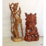 A pair of carved wood oriental statues 1 x 83cm and 1 x 104cm