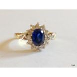A 9ct gold sapphire cluster ring size Q