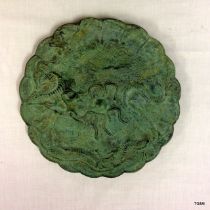 A Chinese Bronze dish with dragon decoration in relief, with seal mark / inscription to the base.