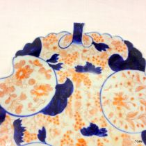 A pair of shaped Imari plates