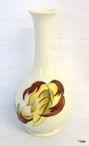 A Moorcroft white glazed vase with flower decoration 20.5cm high