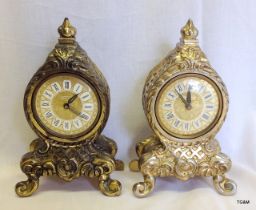 A matched pair of small brass mantle clocks