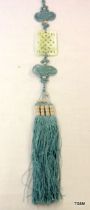 Chinese pale green Jade carving of a knot suspended in an intricate blue silk and tassel cord