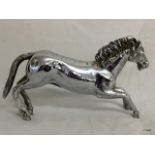 A vintage Chrome plated car mascot in the form of a horse