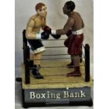 A novelty money box in the form of a boxing ring