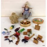 A collection of miniature dolls house items