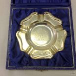 A silver ash tray in its presentation case celebrating the queens 1977 Jubilee