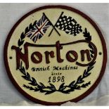 A Round cast 'Norton' sign