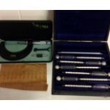 A cased moore & wright 2 to 3 inch, micrometer and a cased specific gravity test set.