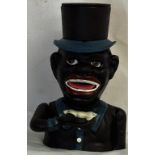 A novelty money box of a man in a hat